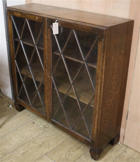 A 1940s oak glazed bookcase W.92cm